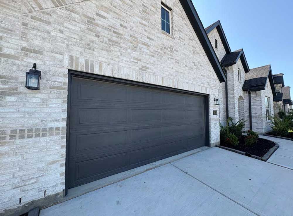 Charcoal flush-panel garage door